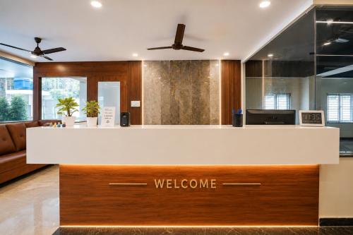 a welcome counter in a lobby with a welcome sign at Hotel Gokul Pride Near Secunderabad Railway station in Hyderabad