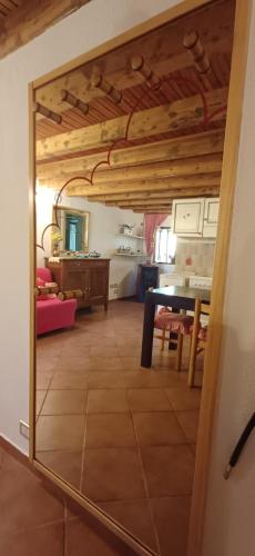a room with a table and a dining room at Nespello Tourist Accommodation in Costa di Serina