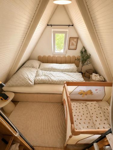 a bedroom with a bed in a attic at Harmónia és Béke Csopak in Csopak