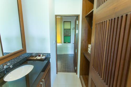 a bathroom with a sink and a shower at Samui Honey Tara Villa Residence in Choeng Mon Beach