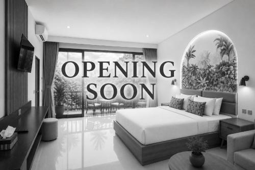 a bedroom with a bed and a opening room sign at Dewangga At MUA in Ubud