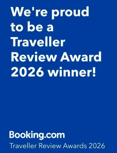a blue sign that says were proud to be a traveller review award winner at binna stay 이태원역7분, 독채,테라스,4 Queen Beds, 무료짐보관 , 명동,홍대,서울역,명동 15분 in Seoul