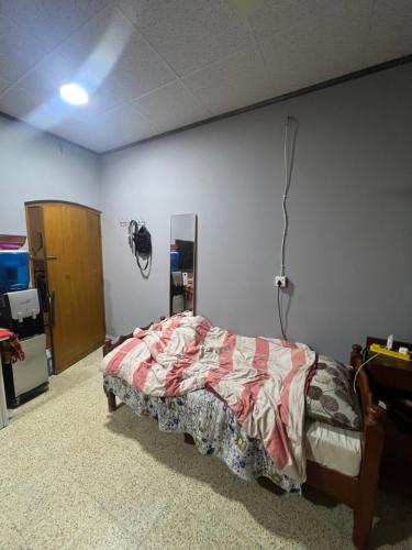 a bedroom with a bed in a room at Traveler rest in Arbājīyah