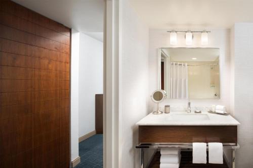 a bathroom with a sink and a mirror at Grand Hyatt San Antonio River Walk in San Antonio