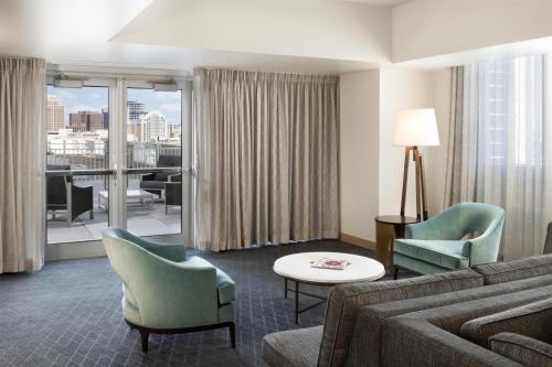 a living room with a couch and chairs and a table at Grand Hyatt San Antonio River Walk in San Antonio
