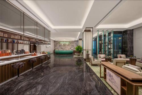 a lobby with a bar and a waiting room at Wyndham Garden Datong Ancient City in Datong