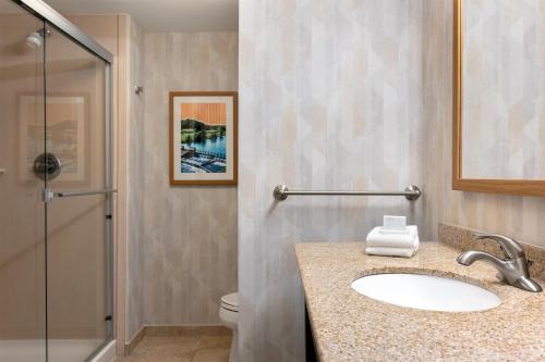 a bathroom with a sink and a shower at Hampton Inn & Suites Prattville in Prattville