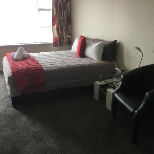 Postel nebo postele na pokoji v ubytování Ascot Oamaru Motel