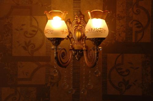 a street light with two lights on a wall at Ista Palace Hotel in Istanbul