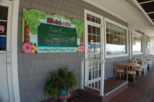 a restaurant with a sign on the side of a building at The Spinnaker in Ocean City