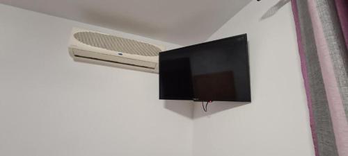 a flat screen tv hanging on a wall at Hostal La Mancha in Ruidera