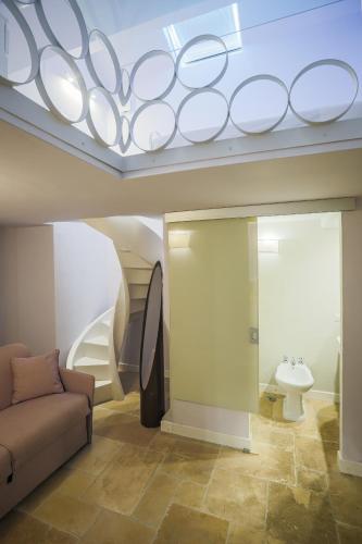 a living room with a couch and a sink at Villa Francesca in Capri