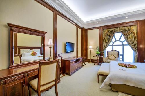 Postel nebo postele na pokoji v ubytování Gladden Hotel Jiangmen