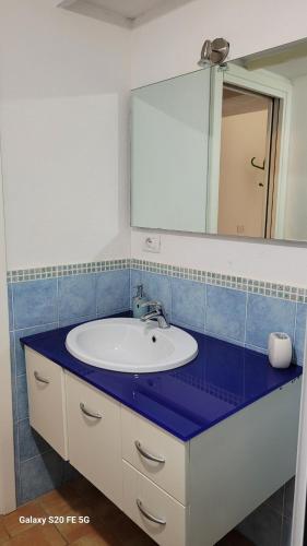 a bathroom with a sink and a mirror at Locanda FarOrientale in Santa Lucia