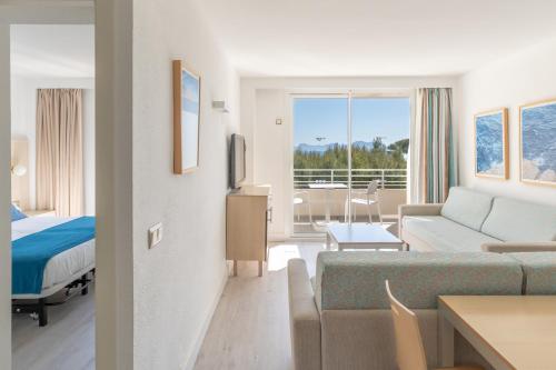 En eller flere senge i et værelse på Hotel Ivory Playa Sports & Spa