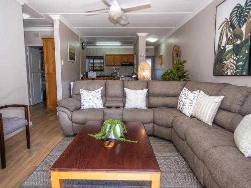 a living room with a couch and a coffee table at Lakeview Cabanas - Unit 11 in St Lucia