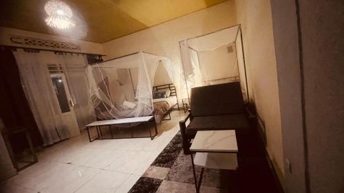 a living room with a couch and a table at Saish Stay in Ruhengeri