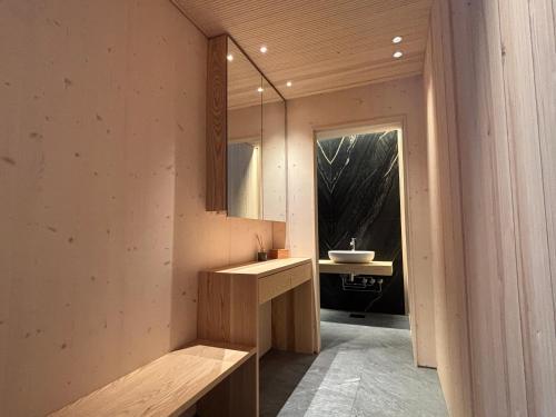 a bathroom with a sink and a mirror at Meteorite House in Kontiolahti