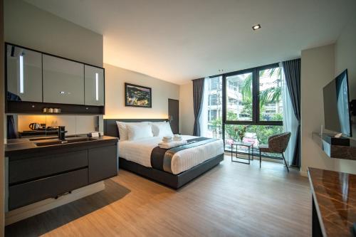 a bedroom with a bed and a sink and a counter at Pim Old Town in Chiang Mai