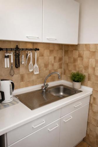 a kitchen with a sink and a counter top at Gästehaus Stillecke in Erwitte