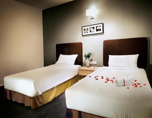 Cama ou camas em um quarto em Sky Hotel @ Selayang