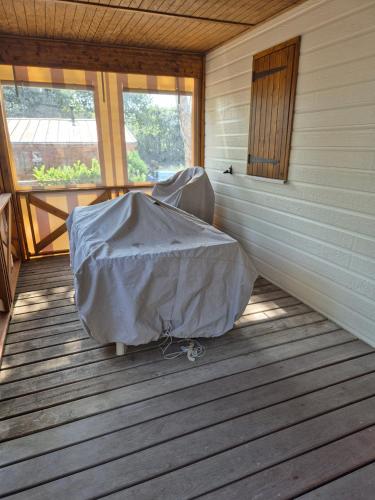 a room with a cover on the floor of a house at Escapade Calme &Nature in Sulniac