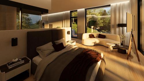 a bedroom with a bed and a couch in a room at Cubea in Bodenmais