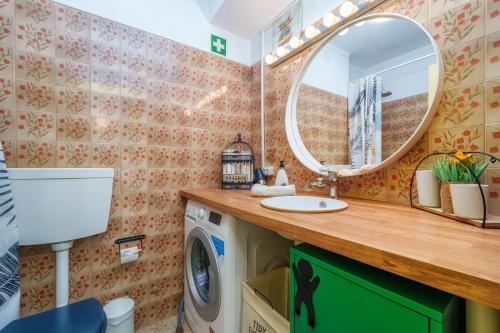 a bathroom with a sink and a mirror at See view Mignon de la Ria Formosa in Faro