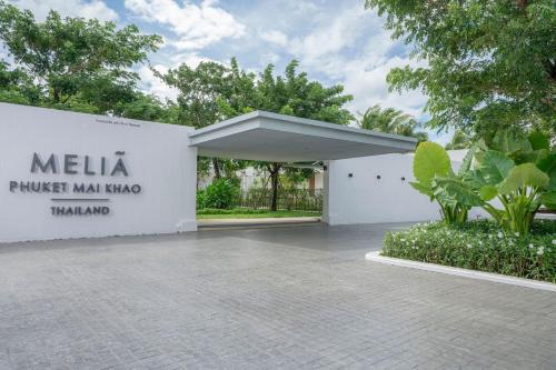 a building with a sign that reads melia punch man nanambowind at Meliá Phuket Mai Khao in Mai Khao Beach