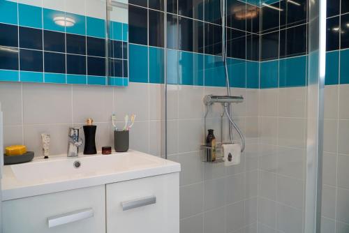 a bathroom with a sink and a shower at Ô Doubs Chalets in Mouthe
