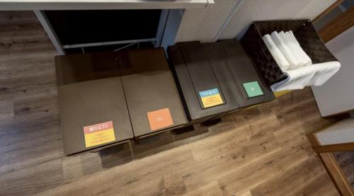 two boxes sitting on the floor in a room at Daruma in Nasu