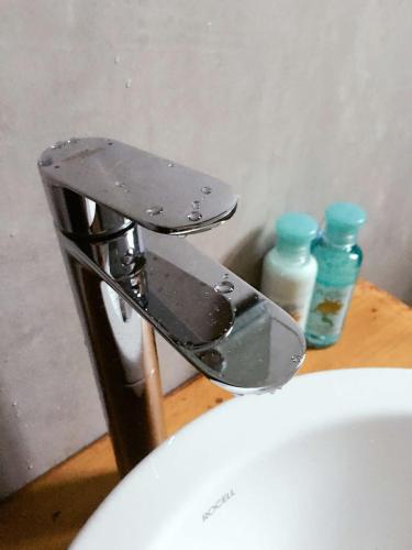 a metal faucet on top of a sink at Melford Nuwaraeliya in Nuwara Eliya