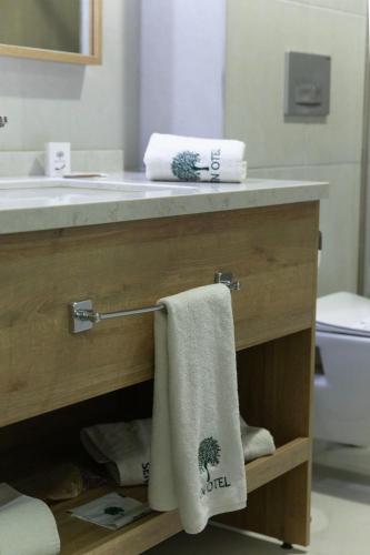 a bathroom with a sink and a towel on a drawer at Sen Otel in Sakarya