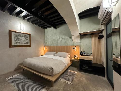 a bedroom with a large bed in a room at Casa 1800 Oaxaca Boutique Hotel in Oaxaca City