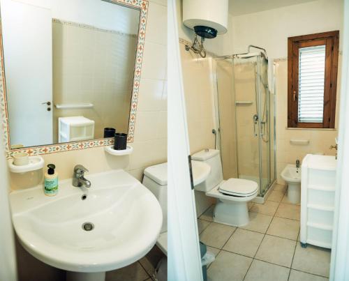 a bathroom with a sink and a toilet and a mirror at Giallomare in Marzamemi