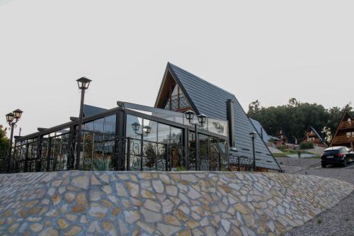 a building with a fence in front of it at Koliba & SPA SlaDjo in Brčko