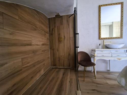a wooden sliding door in a bathroom with a desk at Villa Torre Macastre, Valencia in Macastre