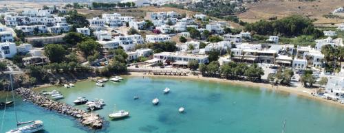 an aerial view of a beach with boats in the water at Anchorage Paros Boutique & Private Beach in Piso Livadi