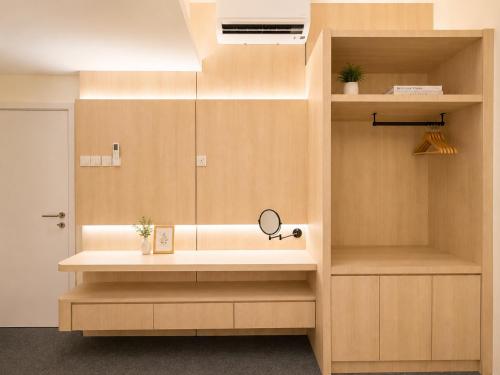 a bathroom with a sink and a mirror at Commune Lane Guesthouse, George Town in George Town