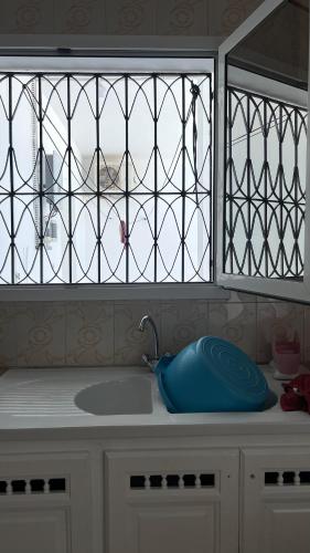 a kitchen counter with a sink and a window at Villa Korba 2nd Floor in Korba