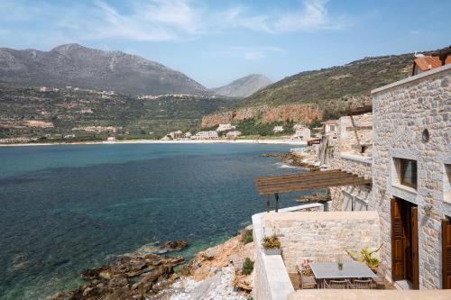 a view of the ocean from a building at Aura Seafront Villa in Neo Itilo
