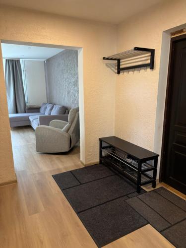 a living room with a couch and a table at Taagepera Guest Apartment in Taagepera