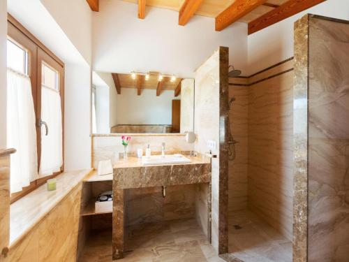 a bathroom with a sink and a shower at Modern Rustic Country Villa with Pool in Lloseta