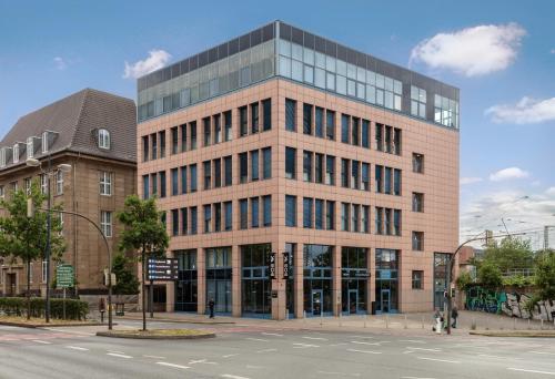 a large brick building on a city street at Bob W Dortmund Stadtmitte in Dortmund
