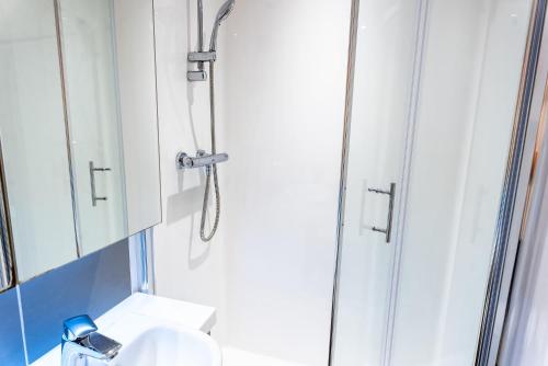a bathroom with a shower and a sink at Student Only Studio in Central Loughborough in Loughborough