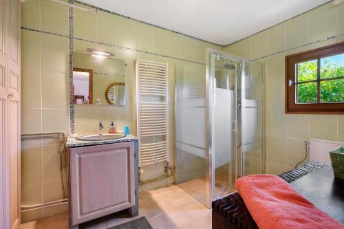 a bathroom with a shower and a sink at La Lufrerie in Sospel