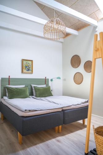 a bedroom with a bed in a room at Lustrup Farmhouse in Ribe