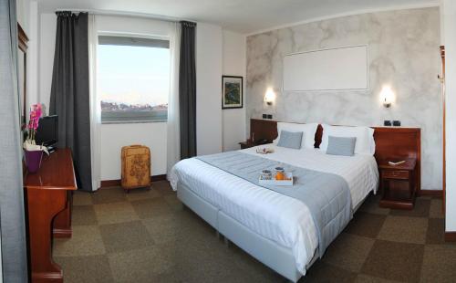 En eller flere senger på et rom på Hotel Medea - Adults Only