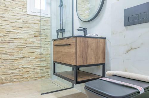 a bathroom with a sink and a shower at Rafaela Sea Gem in Loutraki
