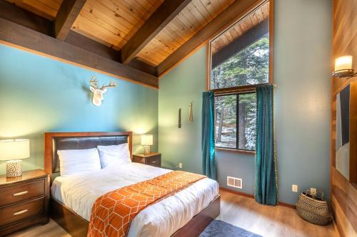 a bedroom with a large bed and a window at Northstar Resort by Vail Resorts in Truckee